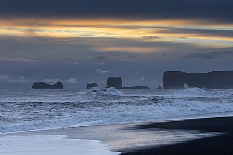 Reynisfjara black sand beach and  Dyrhólaey promontory in the storm, Myrdalur, Iceland